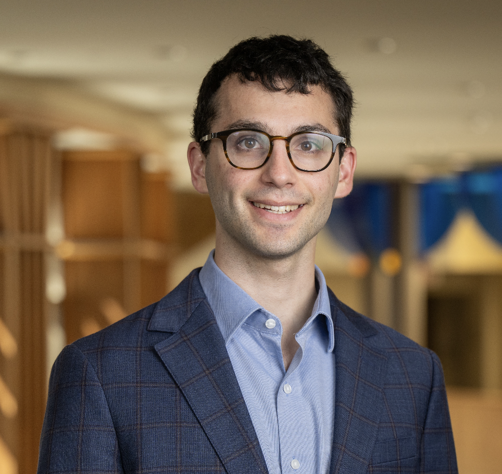 Indoor portrait of a man in a blazer.