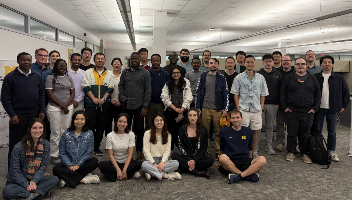 Postdocs Large group photo of people posing indoors.