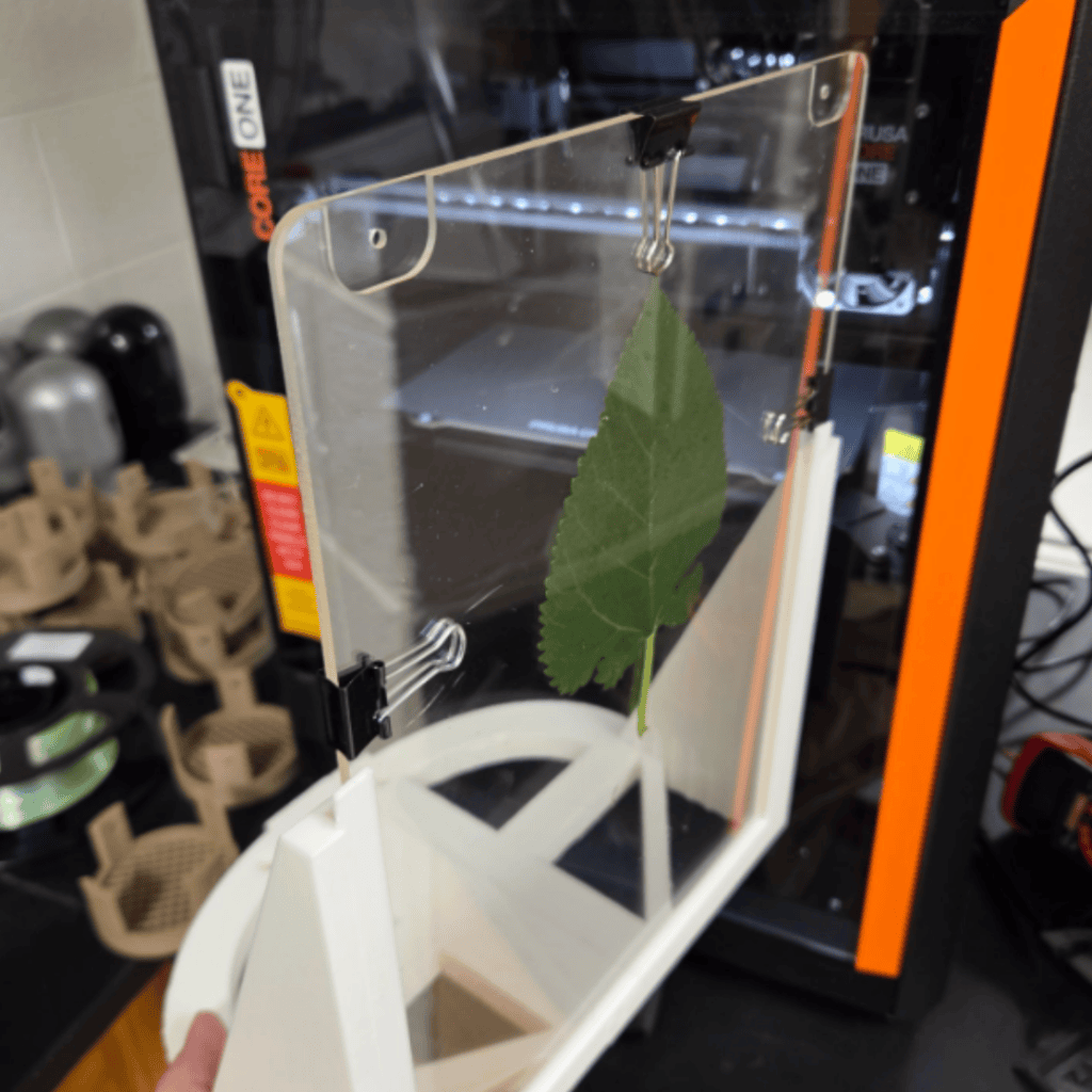 photo shows how we 3D printed a leaf holder to enable more consistent imaging (shown in use below).