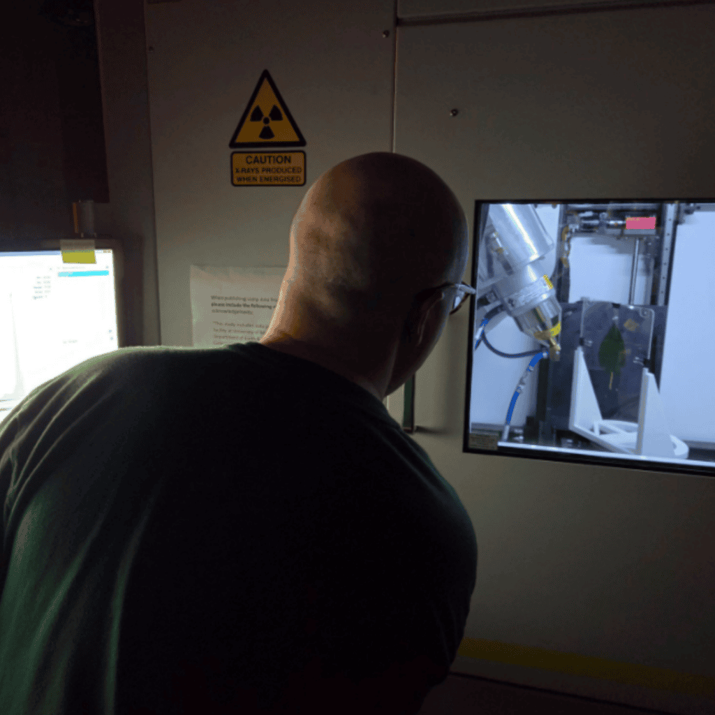 imaging the leaf in Selena Smith's CT Scanner. the lighting is not great inside the machine, but the same leaf from above is getting bombarded with X-rays.